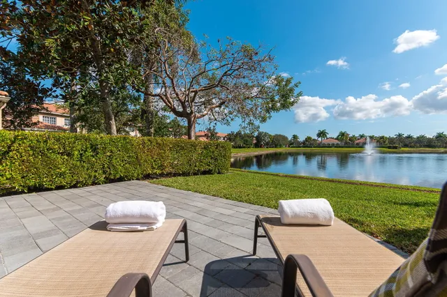 a view of a wooden deck and lake view