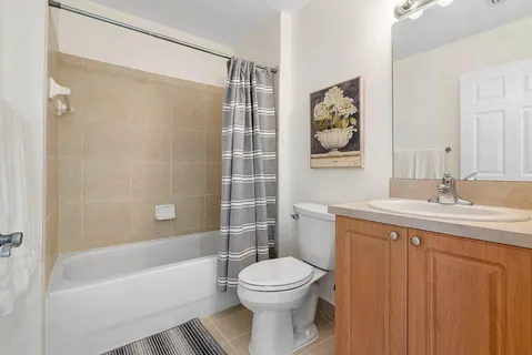 a bathroom with a sink a toilet and a bathtub