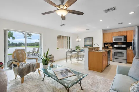 a living room with furniture dining area and a window