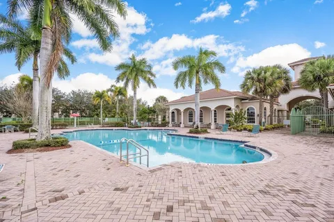 a view of a swimming pool with a lounge chair