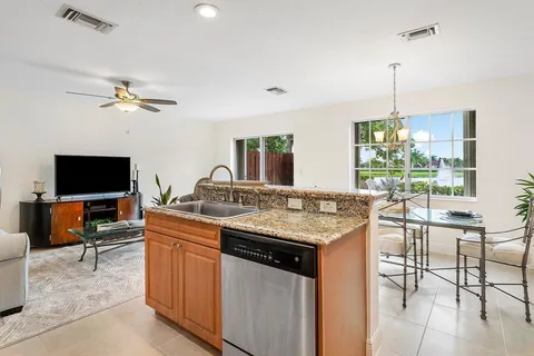 a kitchen with a stove a sink and a refrigerator