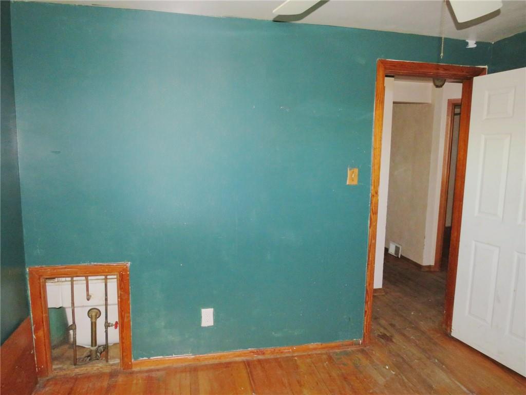 214 Erwin Place McKees Rocks, PA 15136 - Photo 16 of 25 a view of a room with wooden floor and a window