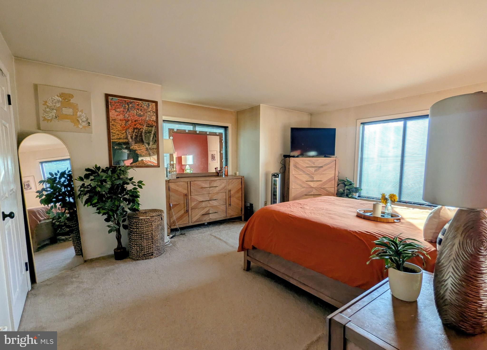 409 Silvia Street Ewing, NJ 08628 - Photo 11 of 16 a bed room with a bed and a chair