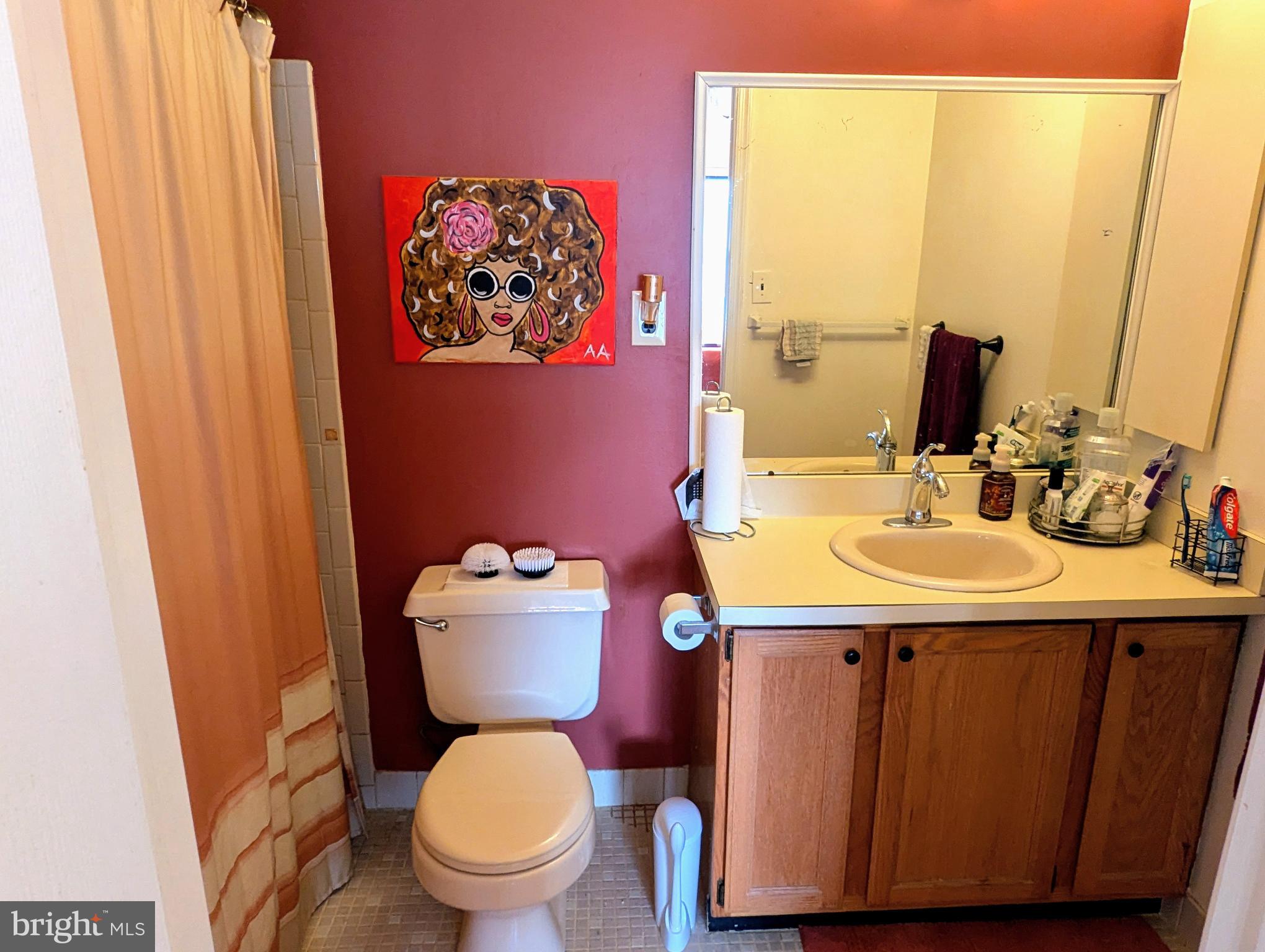 409 Silvia Street Ewing, NJ 08628 - Photo 13 of 16 a bathroom with a toilet sink and mirror