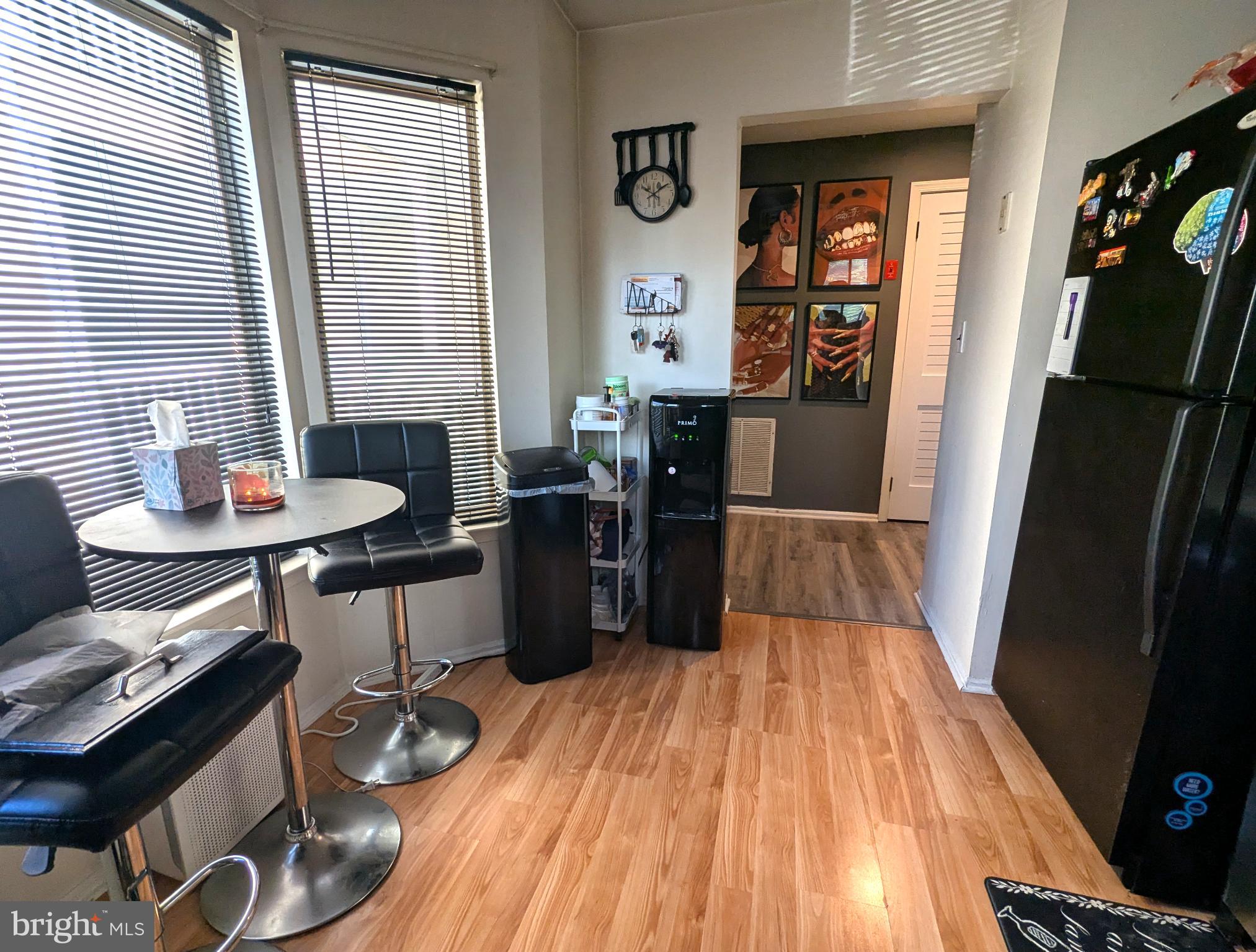 409 Silvia Street Ewing, NJ 08628 - Photo 5 of 16 a kitchen with a sink and wooden floor
