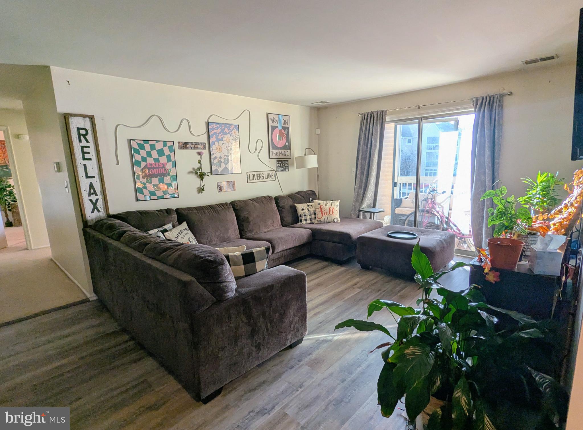 409 Silvia Street Ewing, NJ 08628 - Photo 6 of 16 a living room with furniture potted plant and a window