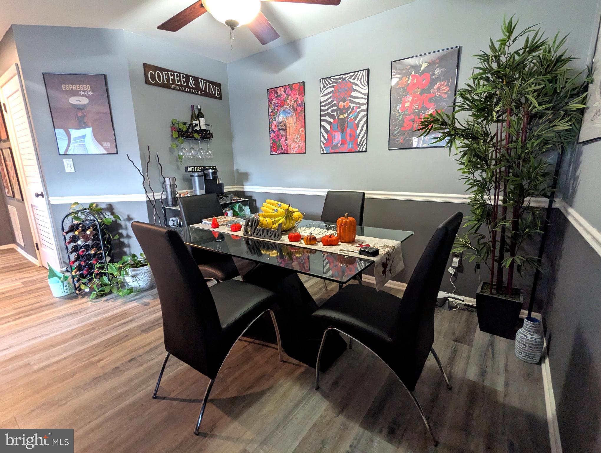 409 Silvia Street Ewing, NJ 08628 - Photo 8 of 16 a view of a dining room with furniture and wooden floor