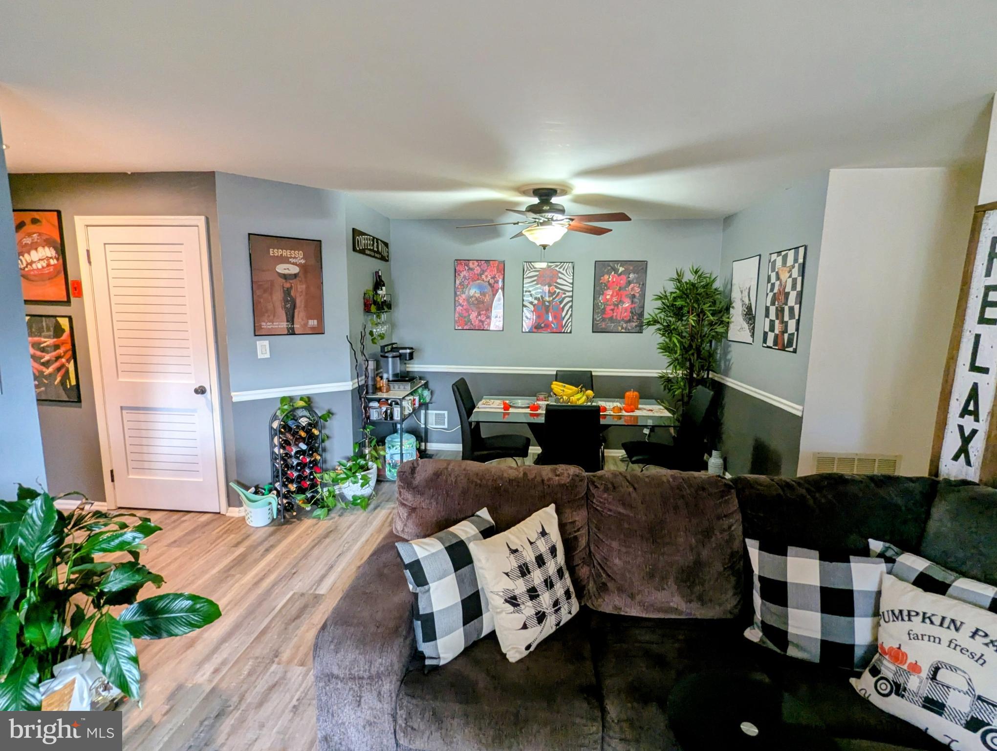 409 Silvia Street Ewing, NJ 08628 - Photo 9 of 16 a living room with furniture and a chandelier