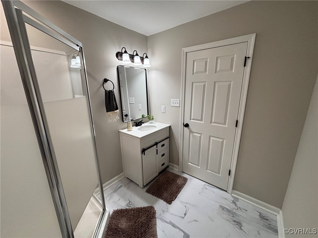 13009 Verdon Road Doswell, VA 23047 - Photo 11 of 17 Full bath with vanity, marble finish floors, and a