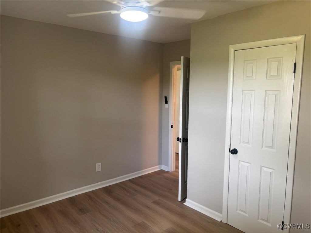 13009 Verdon Road Doswell, VA 23047 - Photo 13 of 17 Unfurnished bedroom featuring dark wood-type floor