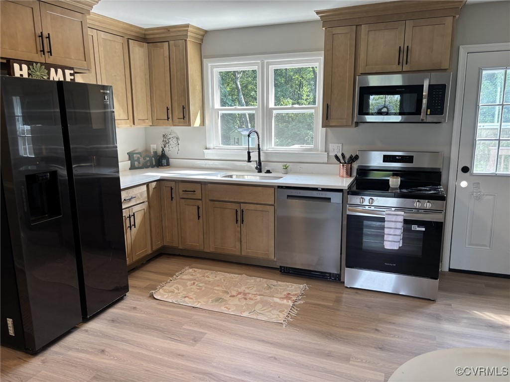 Kitchen featuring appliances with stainless steel