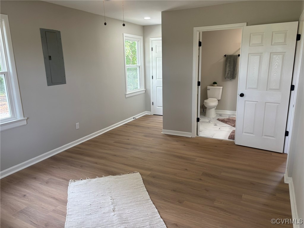 13009 Verdon Road Doswell, VA 23047 - Photo 9 of 17 Unfurnished bedroom featuring electric panel, wood