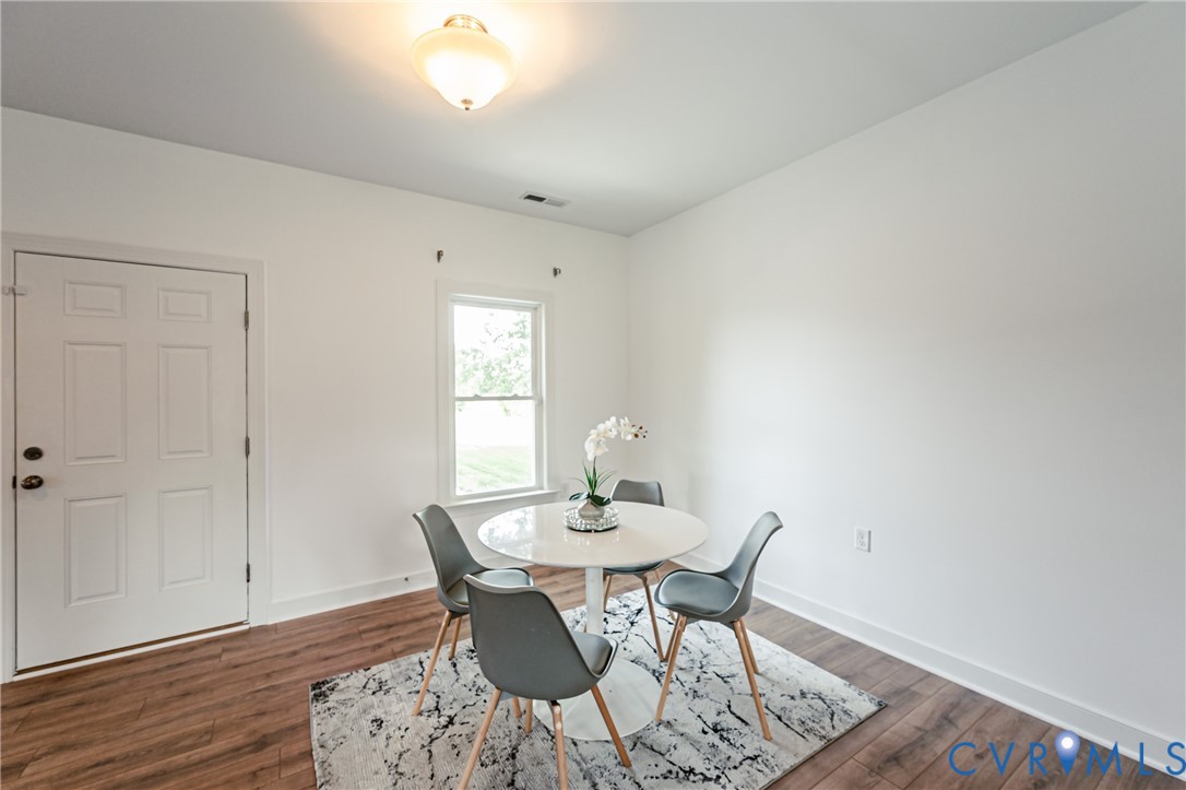 2018 Valentine Road Henrico, VA 23228 - Photo 19 of 65 a dining room with furniture and wooden floor