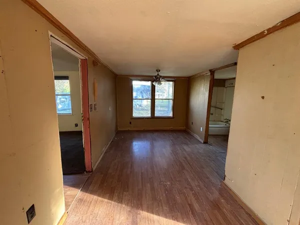 a bathroom with a toilet and a tub