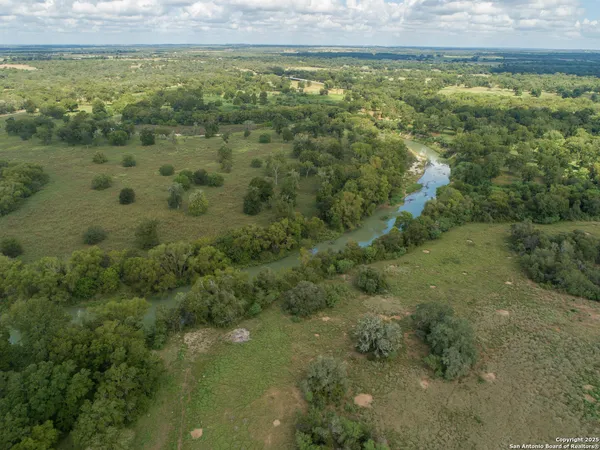 a view of a field with an ocean view