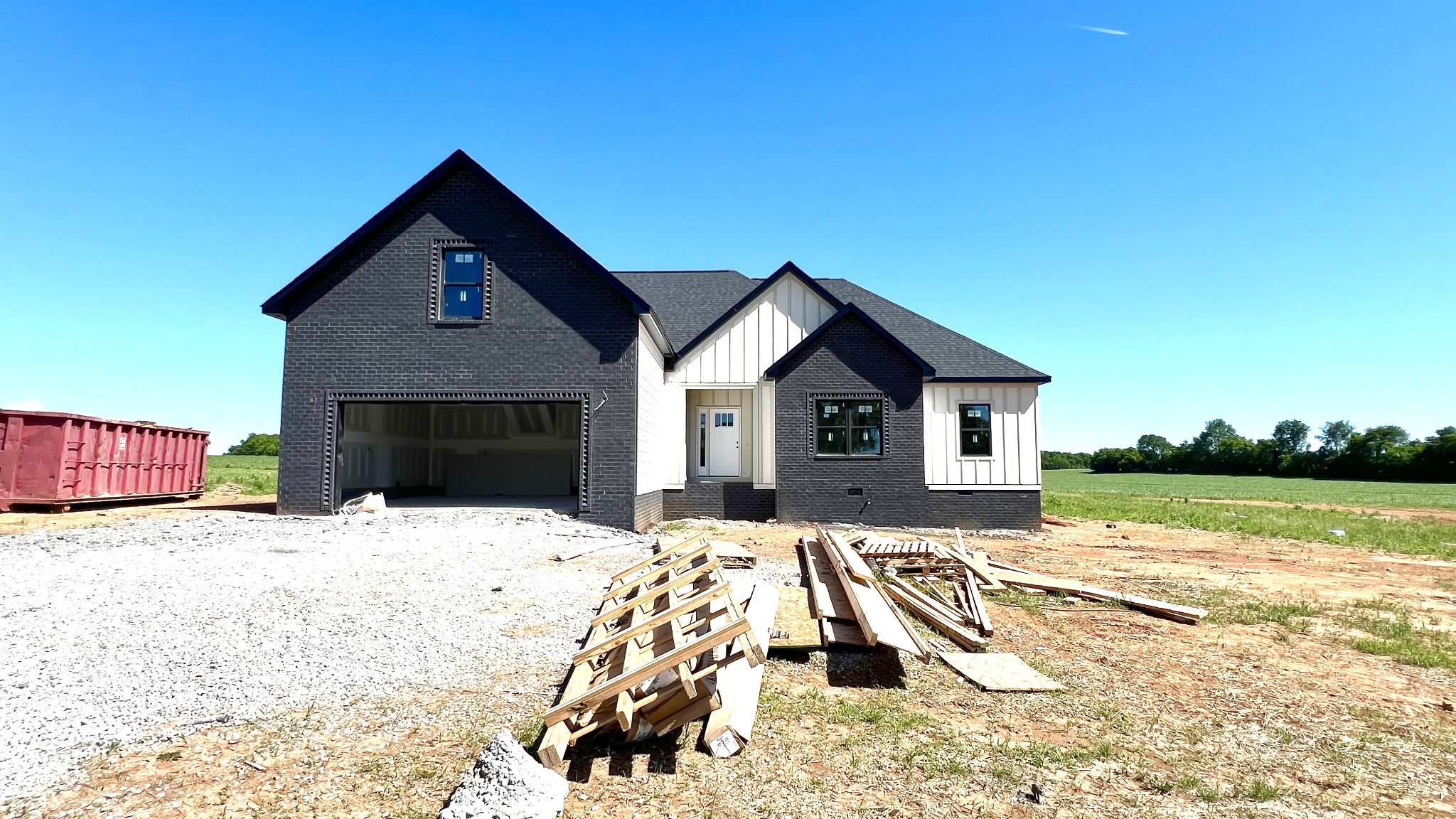 a view of house with yard and swimming pool