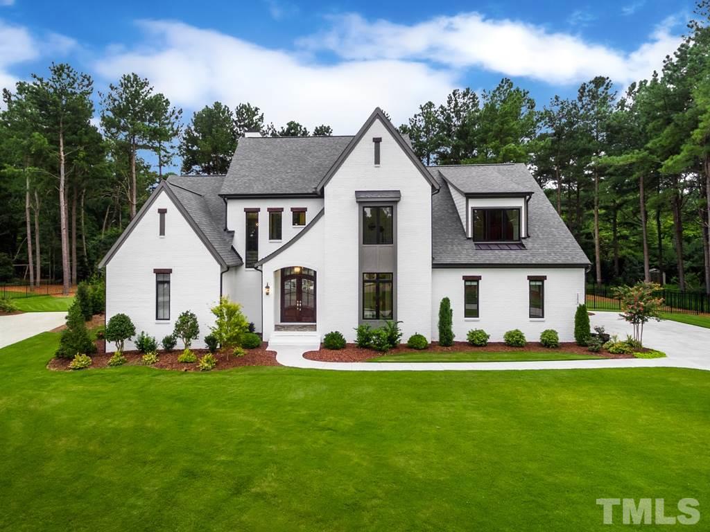 405 Vernon Terrace Raleigh, NC 27609 - Photo 1 of 26 a front view of a house with a garden and plants