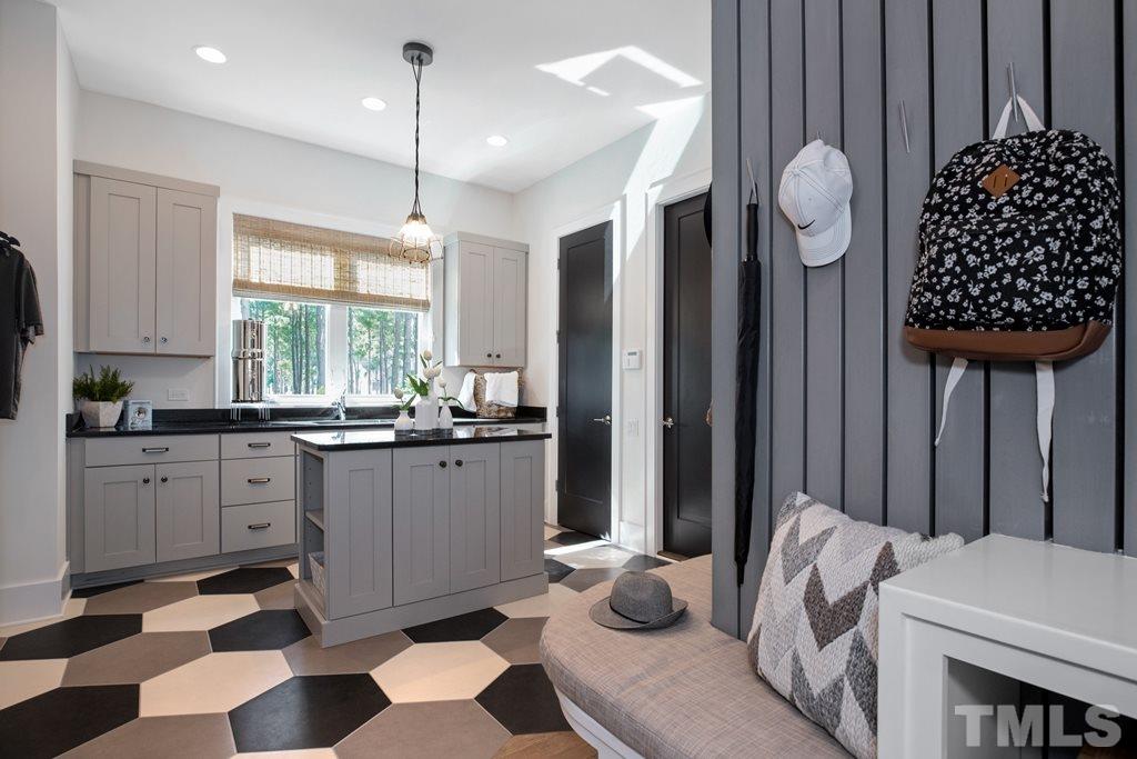 405 Vernon Terrace Raleigh, NC 27609 - Photo 15 of 26 a kitchen with a refrigerator a sink and cabinets
