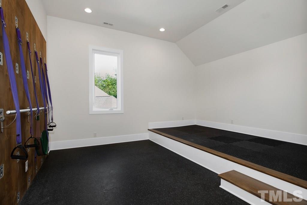 405 Vernon Terrace Raleigh, NC 27609 - Photo 19 of 26 an empty room with wooden floor and windows
