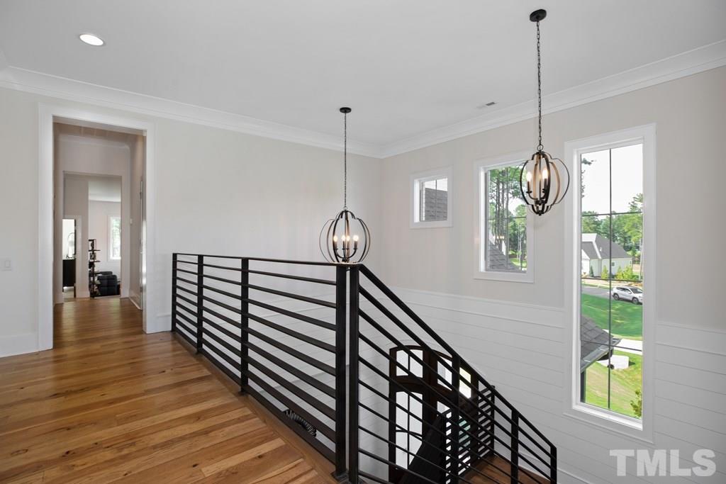 405 Vernon Terrace Raleigh, NC 27609 - Photo 20 of 26 a view of a hallway with wooden floor and windows