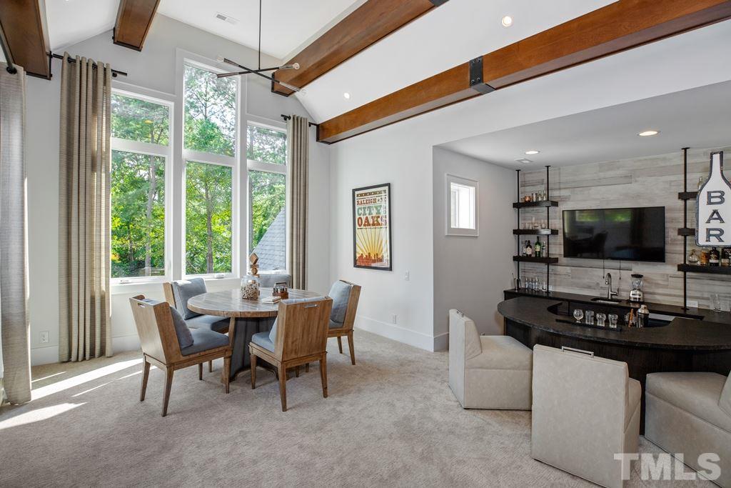 405 Vernon Terrace Raleigh, NC 27609 - Photo 22 of 26 a dining room with furniture and a floor to ceiling window