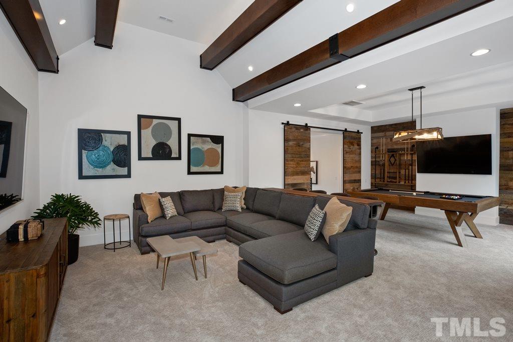 405 Vernon Terrace Raleigh, NC 27609 - Photo 23 of 26 a living room with furniture and a flat screen tv