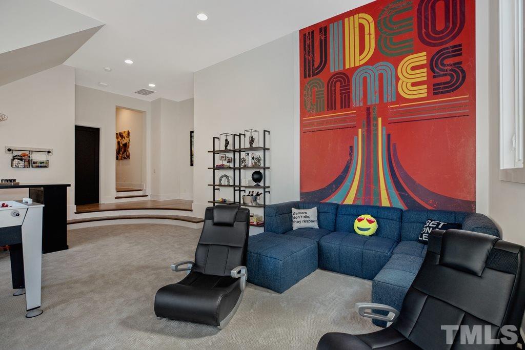 405 Vernon Terrace Raleigh, NC 27609 - Photo 25 of 26 a living room with furniture and a gym equipment