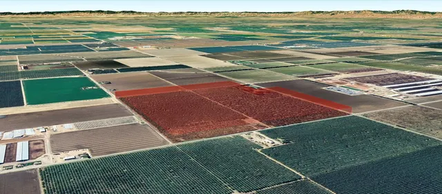 a view of a tennis court with an ocean view