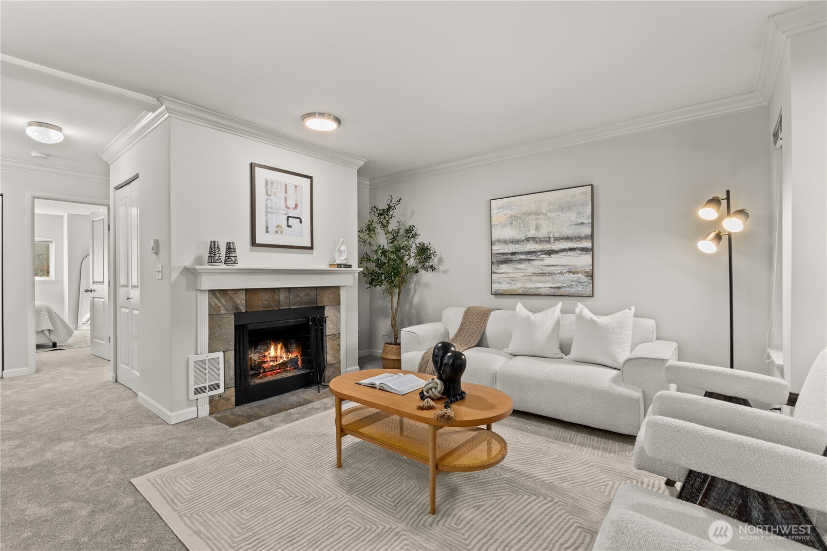 31500 33rd Place Southwest, Unit N103 Federal Way, WA 98023 - Photo 1 of 25 a living room with furniture and a fireplace
