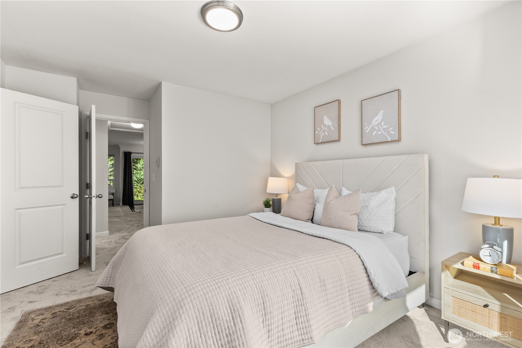31500 33rd Place Southwest, Unit N103 Federal Way, WA 98023 - Photo 12 of 25 a bedroom with a bed and a lamp