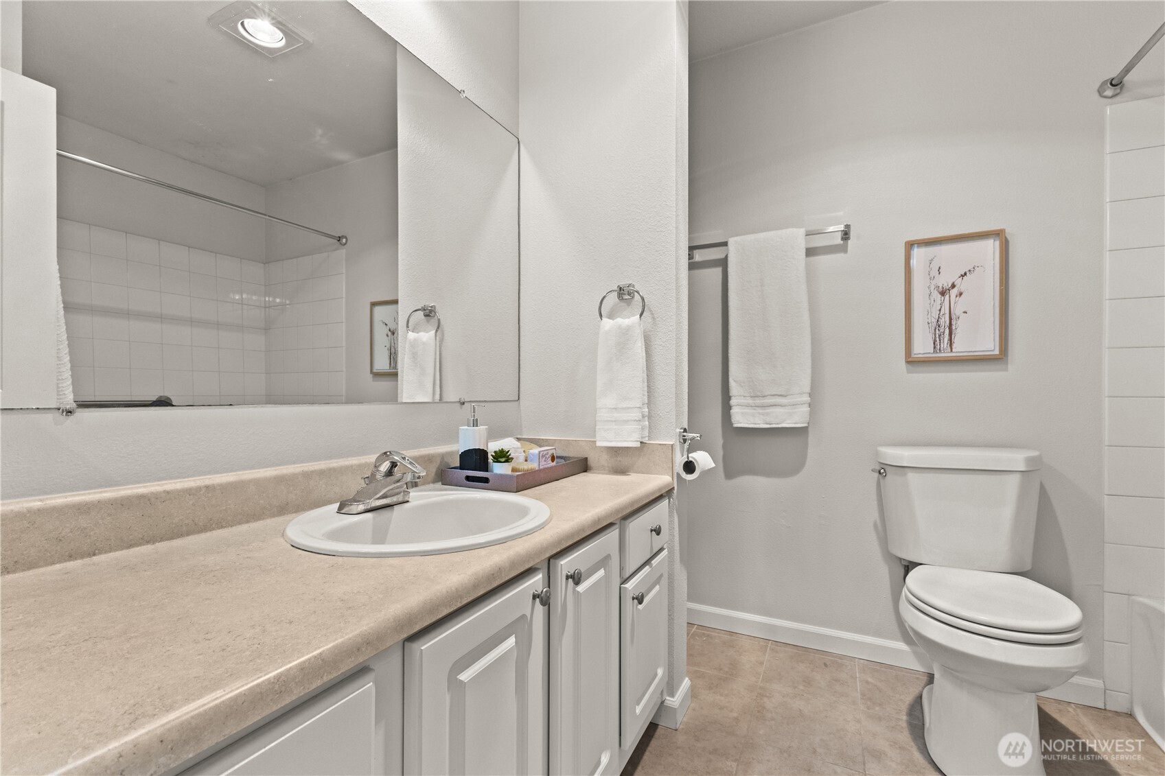 31500 33rd Place Southwest, Unit N103 Federal Way, WA 98023 - Photo 13 of 25 a bathroom with a sink a toilet and mirror