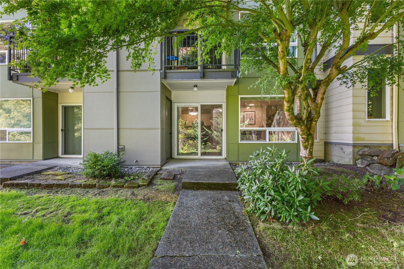 31500 33rd Place Southwest, Unit N103 Federal Way, WA 98023 - Photo 15 of 25 a front view of a house with garden