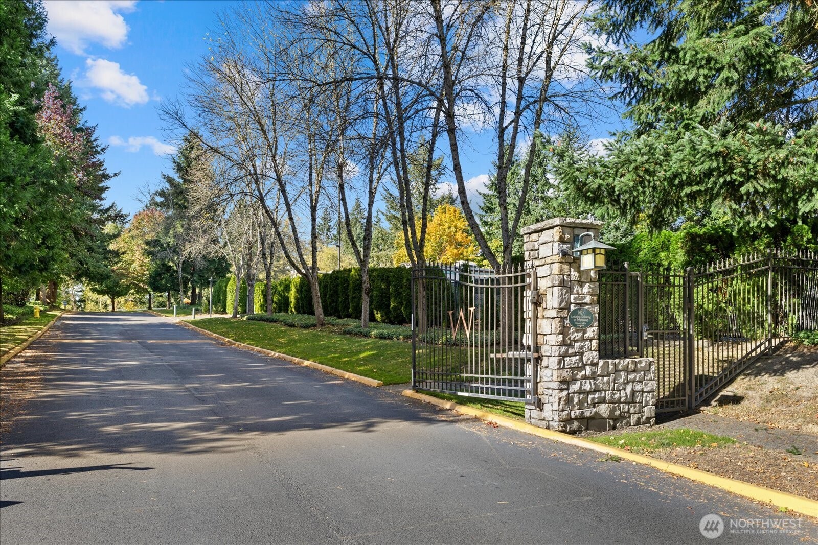 31500 33rd Place Southwest, Unit N103 Federal Way, WA 98023 - Photo 24 of 25 a view of a street with a large tree