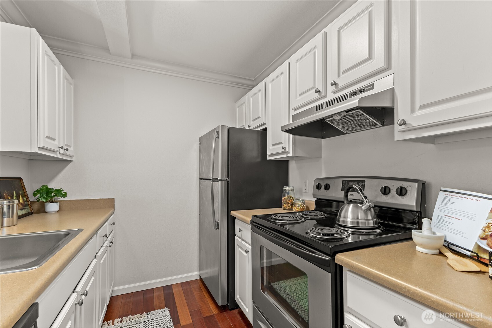 31500 33rd Place Southwest, Unit N103 Federal Way, WA 98023 - Photo 10 of 25 a kitchen with stainless steel appliances granite countertop a stove a refrigerator and a sink