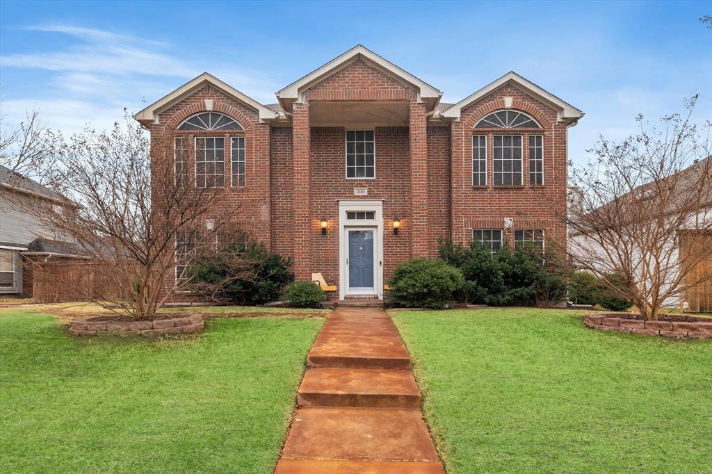 a front view of a house with yard