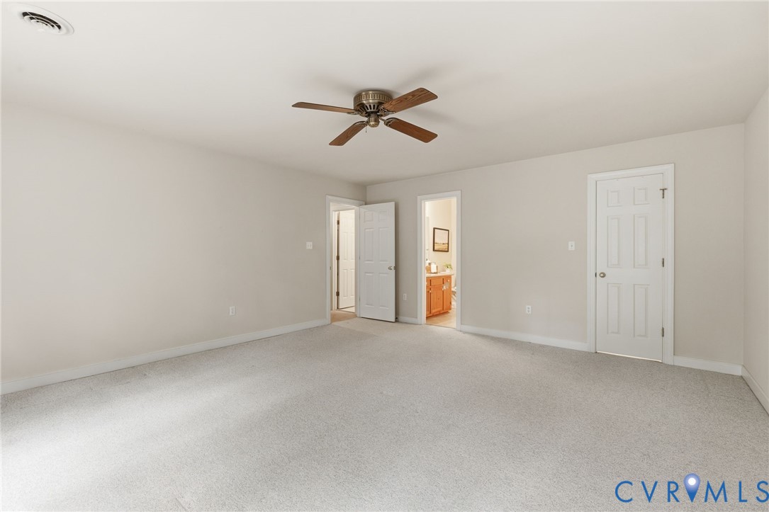 2615 Salisbury Road Midlothian, VA 23113 - Photo 21 of 36 an empty room with windows and fan