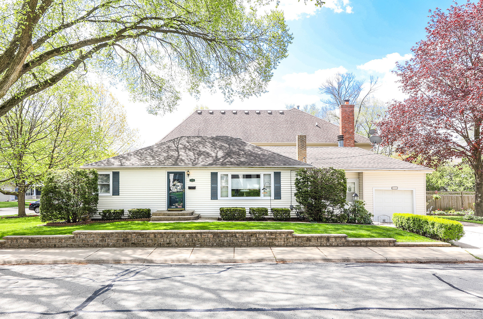 110 West 12th Avenue Naperville, IL 60563 - Photo 1 of 20 a front view of a house with a garden