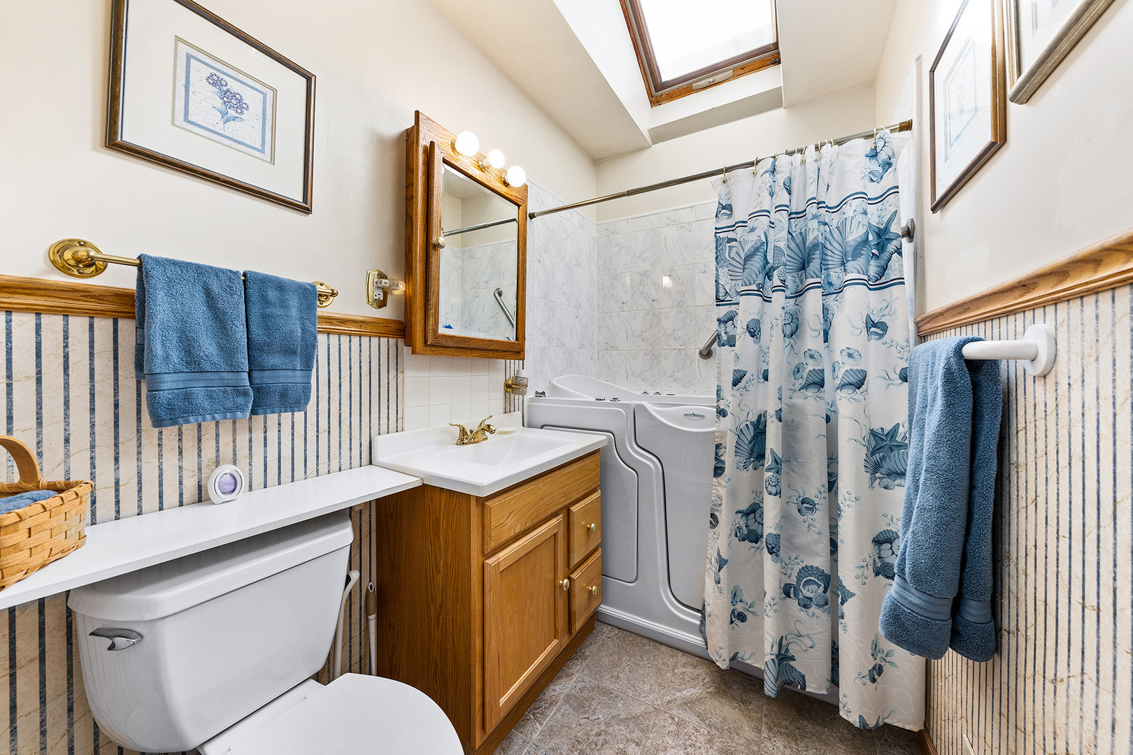 110 West 12th Avenue Naperville, IL 60563 - Photo 13 of 20 a bathroom with a sink toilet and shower