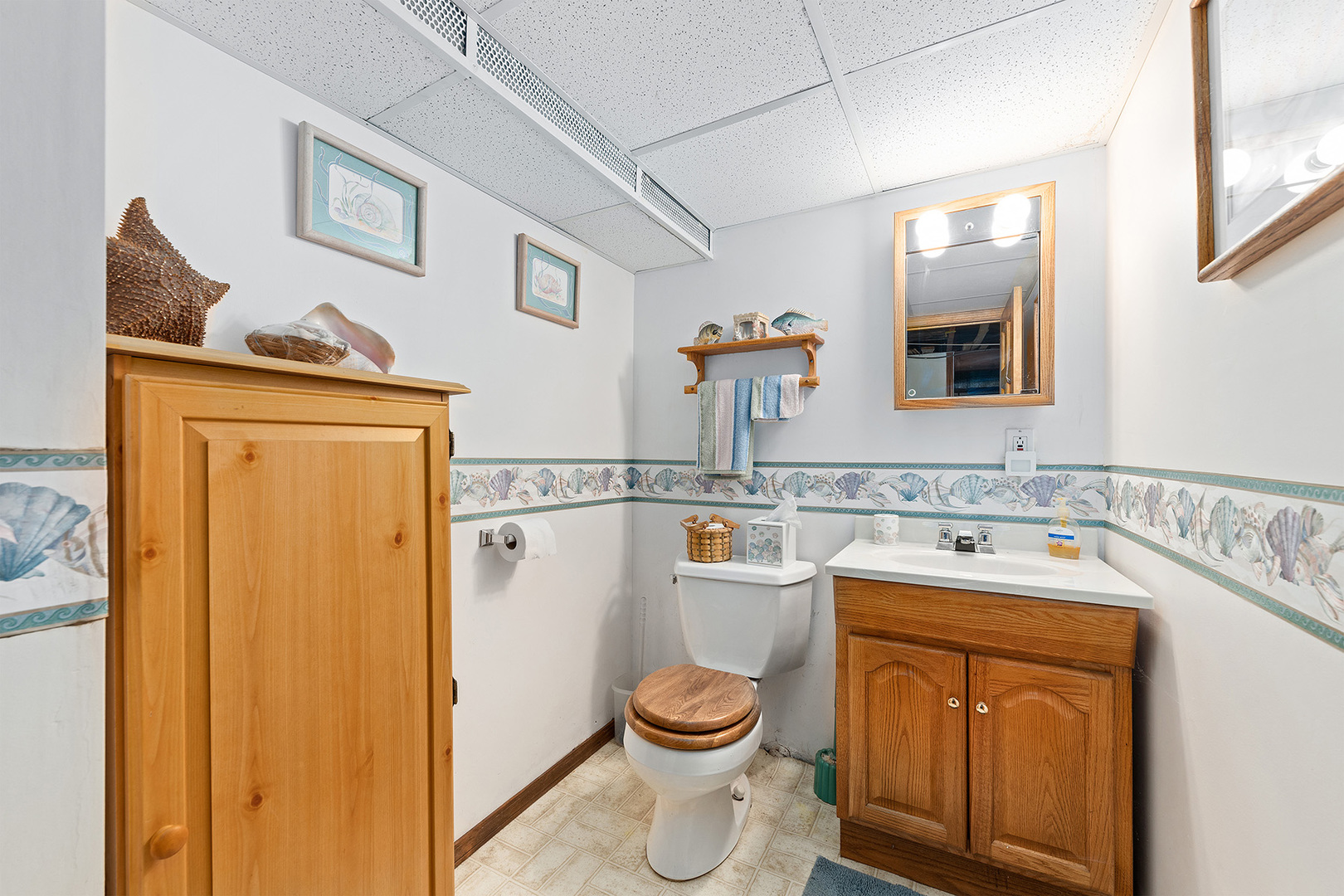 110 West 12th Avenue Naperville, IL 60563 - Photo 15 of 20 a bathroom with a granite countertop toilet sink and mirror
