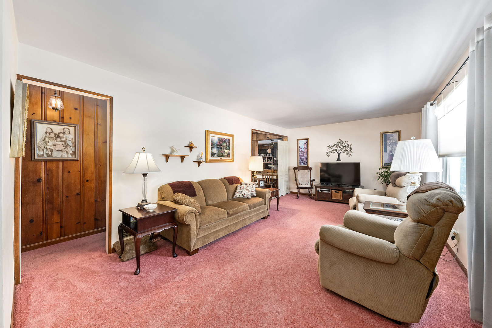 110 West 12th Avenue Naperville, IL 60563 - Photo 3 of 20 a living room with furniture and a couch