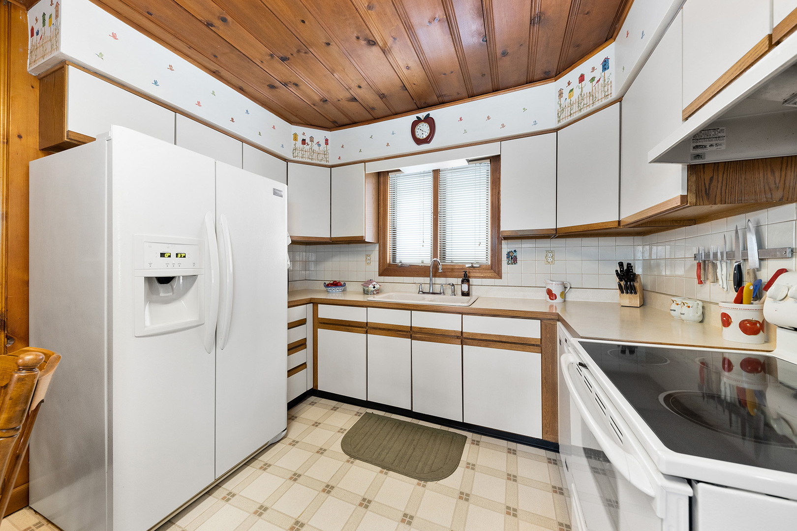 110 West 12th Avenue Naperville, IL 60563 - Photo 7 of 20 a kitchen with a sink cabinets stainless steel appliances and a window