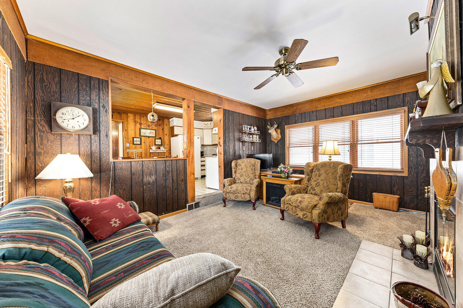 110 West 12th Avenue Naperville, IL 60563 - Photo 9 of 20 a living room with furniture a fireplace and a large window