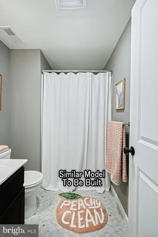 a view of bathroom with a toilet and a shower