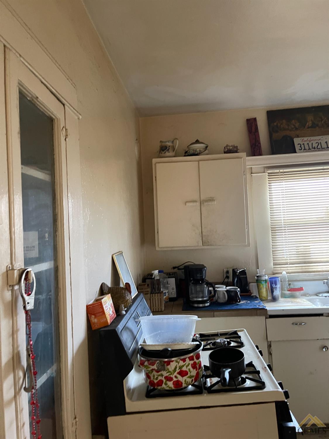 Undisclosed Address Bakersfield, CA 93304 - Photo 16 of 21 a room with furniture a window and potted plant
