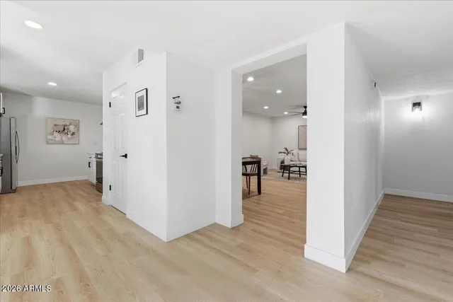 a kitchen with stainless steel appliances kitchen island a chandelier