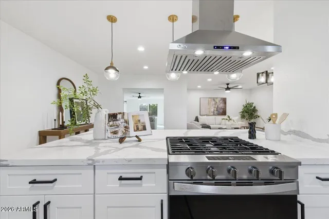 a kitchen with a stove and cabinets