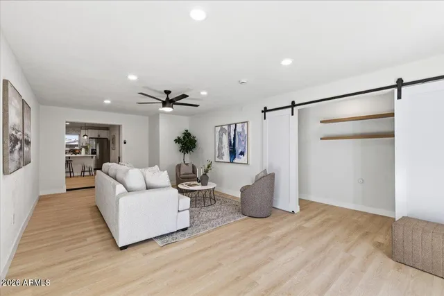 a living room with furniture and a potted plant