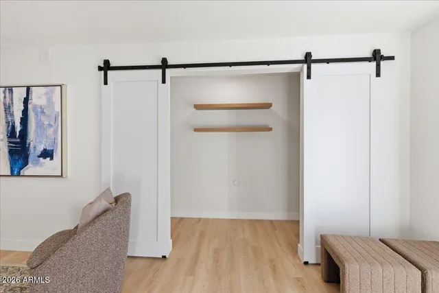 a room with a dresser and a mirror