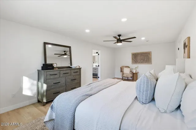 a kitchen with a sink cabinets and wooden floor