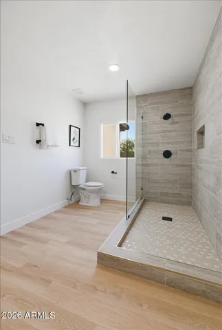 a bathroom with a sink a mirror and shower